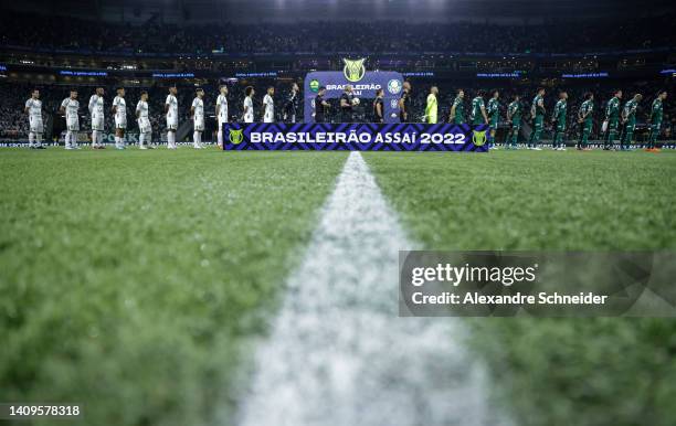 Players of Cuiaba and Palmeiras stand for the national anthem prior a match between Palmeiras and Cuiaba as part of Brasileirao Series 2022 at...