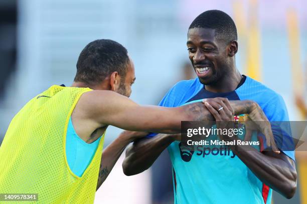 Pierre-Emerick Aubameyang and Ousmane Dembele of FC Barcelona interact during a training session ahead of the preseason friendly against Inter Miami...