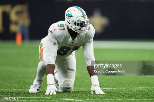 Emmanuel Ogbah of the Miami Dolphins gets set during an NFL game against the New Orleans Saints at Caesars Superdome on December 27, 2021 in New...