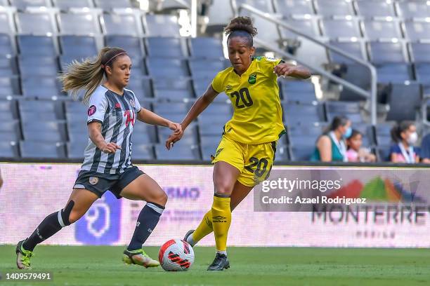 Atlanta Primus of Jamaica fights for the ball with Priscila Chinchilla of Costa Rica during the third place match between Costa Rica and Jamaica as...