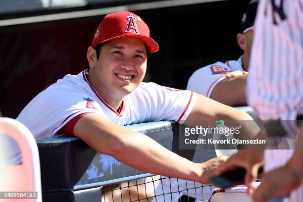 American League All-Star Shohei Ohtani of the Los Angeles Angels looks on before the start of the 2022 T-Mobile Home Run Derby at Dodger Stadium on...