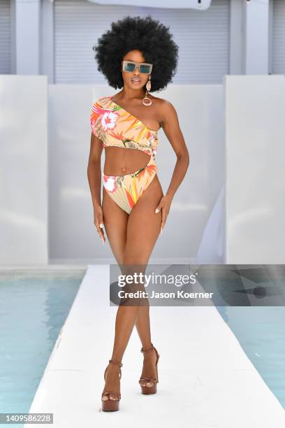 Model walks the runway wearing SPERO SUR MER with Hautelifeworld Eyewear and Melinda Hazel jewelry during Flying Solo Miami Swim Week 2022 on July...