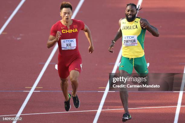 Zhenye Xie of Team China and Rasheed Dwyer of Team Jamaica compete in the Men's 200m heats on day four of the World Athletics Championships Oregon22...