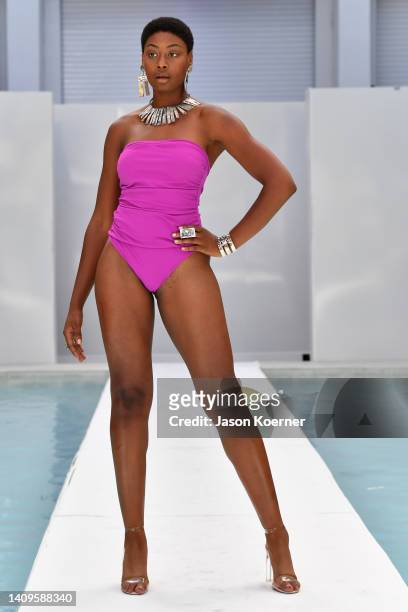 Model walks the runway wearing Porshia with Jill Herlands jewelry during Flying Solo Miami Swim Week 2022 on July 18, 2022 in Miami Beach, Florida.