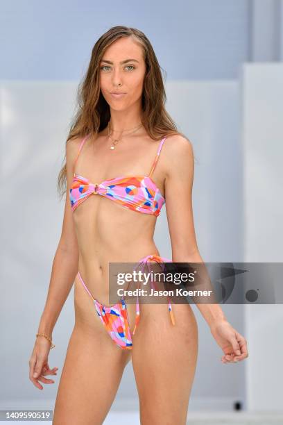 Model walks the runway wearing THOSE SEEN DANCING SWIMWEAR with Meredith Ashley Jewelry during Flying Solo Miami Swim Week 2022 on July 18, 2022 in...