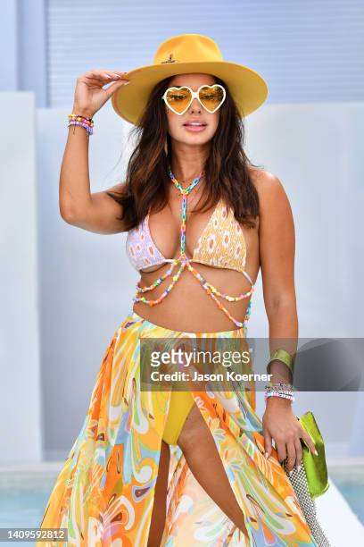 Model walks the runway wearing Mamie Ruth with VOLTA ATELIER handbags during Flying Solo Miami Swim Week 2022 on July 18, 2022 in Miami Beach,...