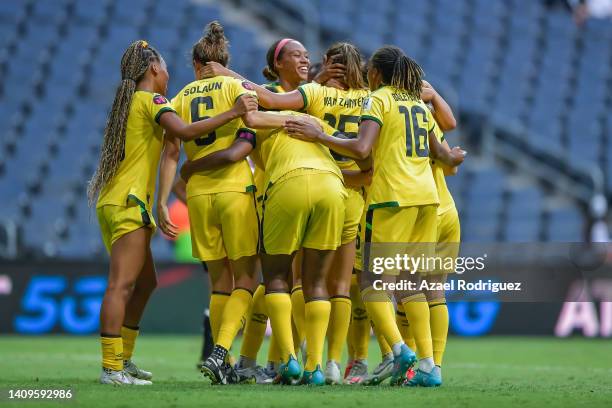 Kalyssa Van Zanten of Jamaica celebrates with teammates after scoring her team's first goal during the third place match between Costa Rica and...