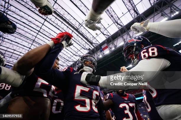 Christian Kirksey of the Houston Texans leads the pregame huddle against the Tennessee Titans prior to an NFL game at NRG Stadium on January 09, 2022...