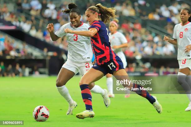 Kadeisha Buchanan of Canada fights for the ball with Alex Morgan of United States during the championship match between United States and Canada as...
