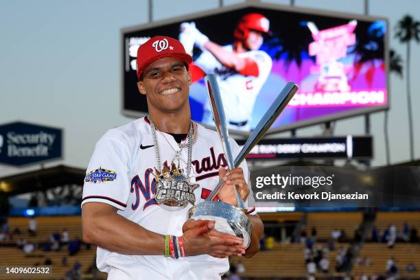 National League All-Star Juan Soto of the Washington Nationals poses with the 2022 T-Mobile Home Run Derby trophy after winning the event at Dodger...
