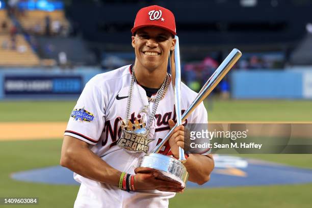 National League All-Star Juan Soto of the Washington Nationals poses with the 2022 T-Mobile Home Run Derby trophy after winning the event at Dodger...