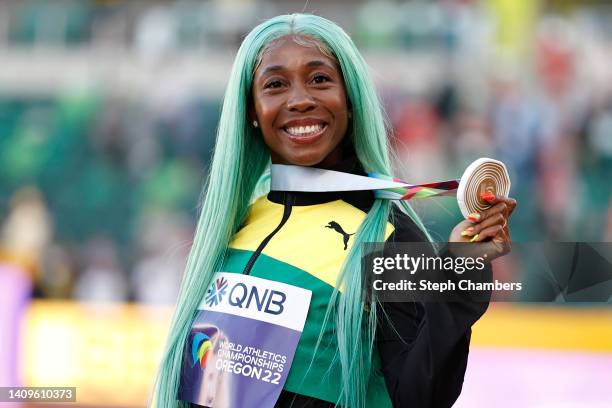 Gold medalist Shelly-Ann Fraser-Pryce of Team Jamaica poses during the medal ceremony for the Women's 100m Final on day four of the World Athletics...