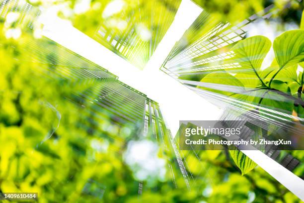 cityscape mixed with green plants, multi layered image. - climate finance stock pictures, royalty-free photos & images