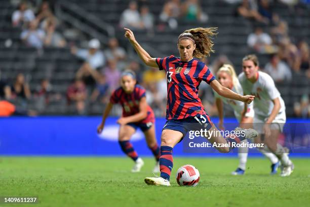 Alex Morgan of USA kicks a penalty to score her team's first goal during the championship match between United States and Canada as part of the 2022...