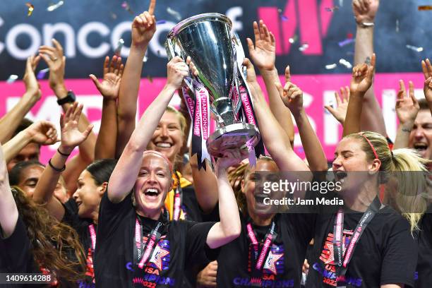 Lindsey Horan and Becky Sauerbrunn of USA celebrate with the champion's trophy after winning the championship match between United States and Canada...