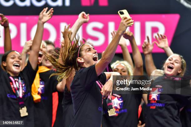 Alex Morgan of United States celebrates with teammates after winning the championship match between United States and Canada as part of the 2022...