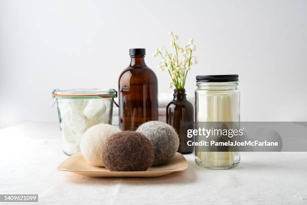 zero waste laundry tablets, soap, sheets and dryer balls - filling jar stock pictures, royalty-free photos & images