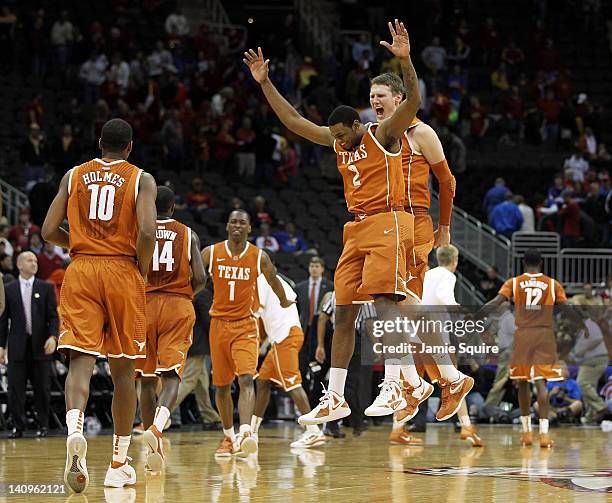 Jaylen Bond and Clint Chapman of the Texas Longhorns celebrate after the Longhorns defeated the Iowa State Cyclones to win the NCAA Big 12 basketball...