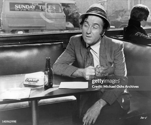 Marty Ingels having beer in a scene from the film 'If It's Tuesday, This Must Be Belgium', 1969.