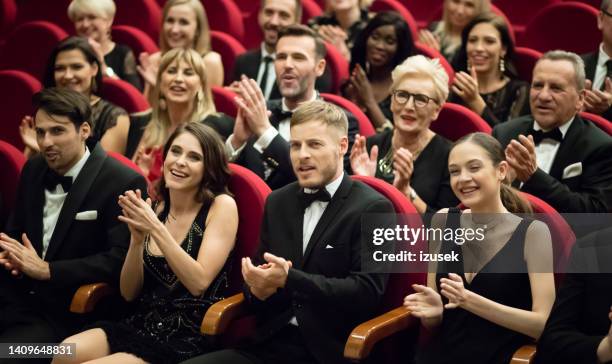 excited audience clapping in opera house - fancy gala stock pictures, royalty-free photos & images