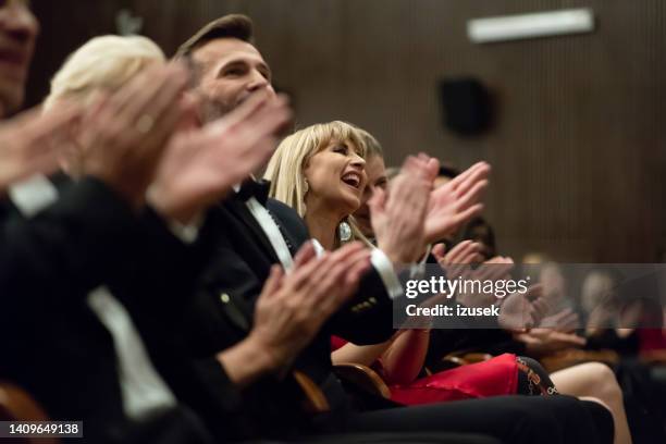 excited audience clapping in the theater - klassiek-concert stockfoto's en -beelden