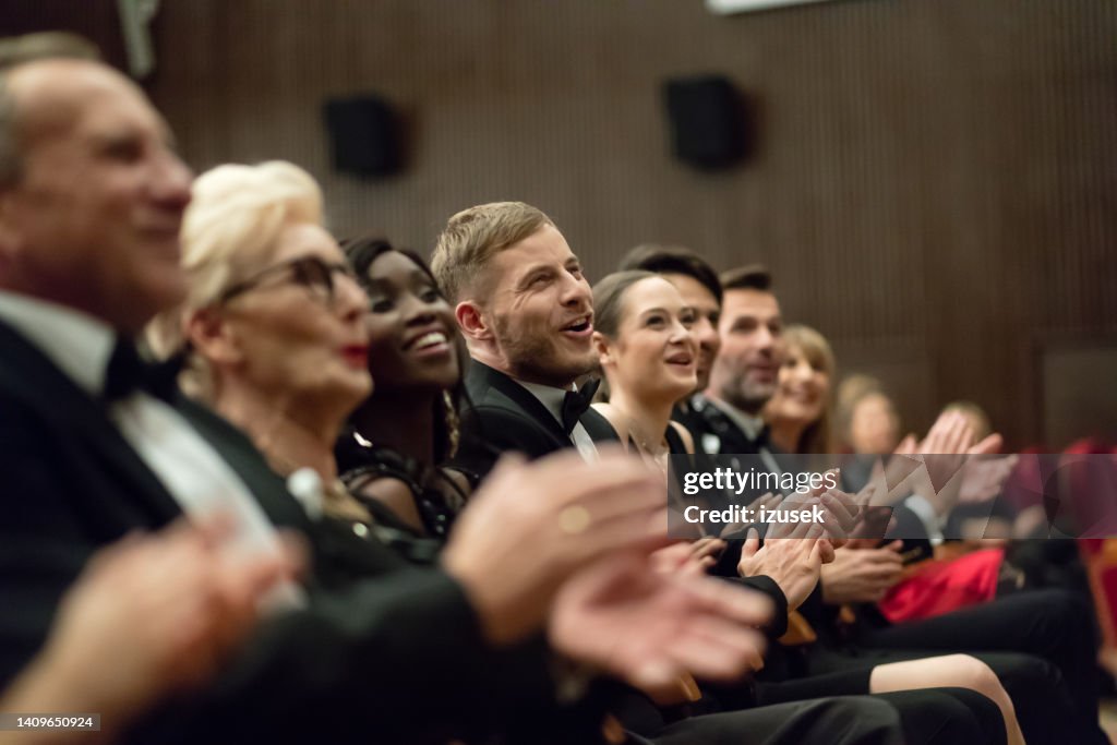 Spectators clapping in the theater, close up of hands
