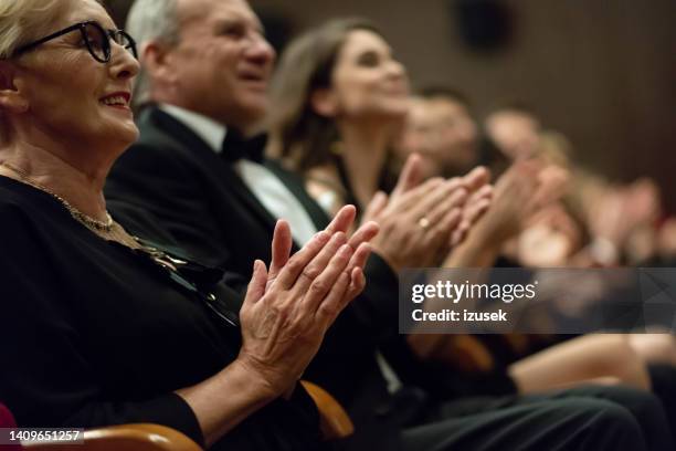spectators clapping in the theater, focus on hands - enthusiastic theater audience clapping stock pictures, royalty-free photos & images