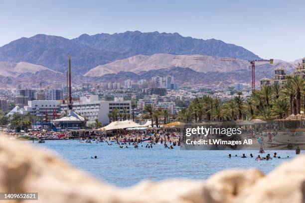 Busy sea front at the North Beach in Eilat on July 16 in Eilat, Israel. Coral reefs are complete ecosystems, and although the coral reef in Eilat may...