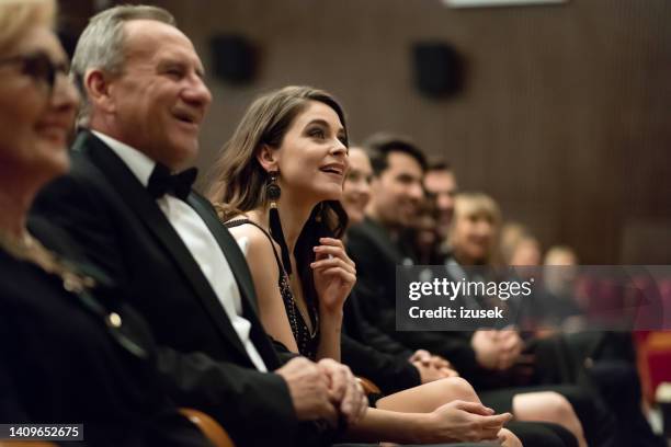 spectators sitting in the theater - traje a rigor imagens e fotografias de stock