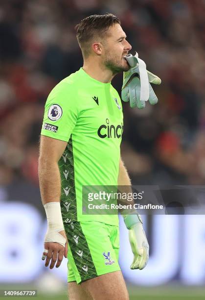 Crystal Palace goalkeeper Jack Butland walks off after he injured his hand stopping a shot from Anthony Martial of Manchester United during the...