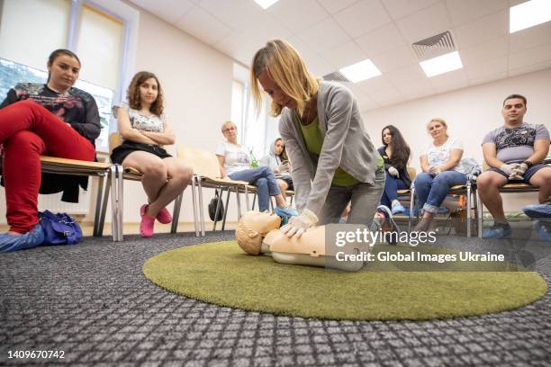 Participant practices in cardiopulmonary resuscitation on a mannequin doll at first aid class on July 11, 2022 in Kyiv, Ukraine. Under martial law...