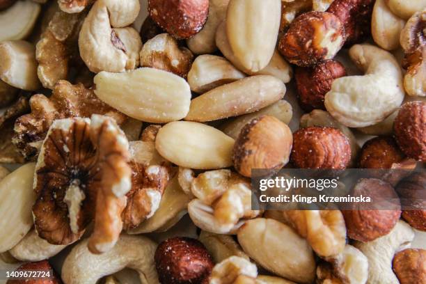 mixed nuts - pecan nut stock pictures, royalty-free photos & images