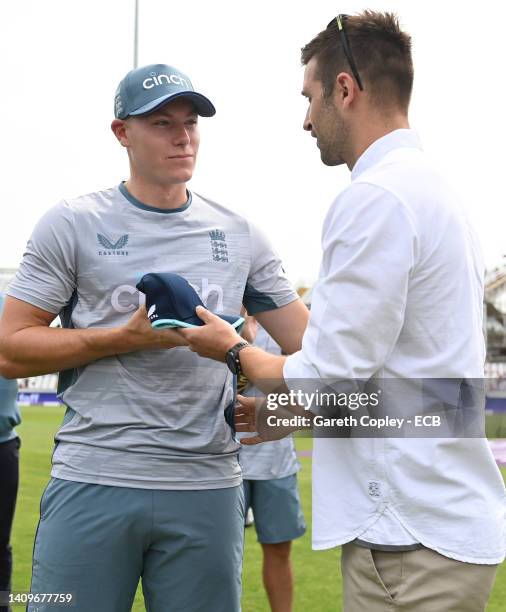 Matthew Potts of England receives his first ODI cap from Mark Wood ahead of the 1st Royal London Series One Day International match between England...