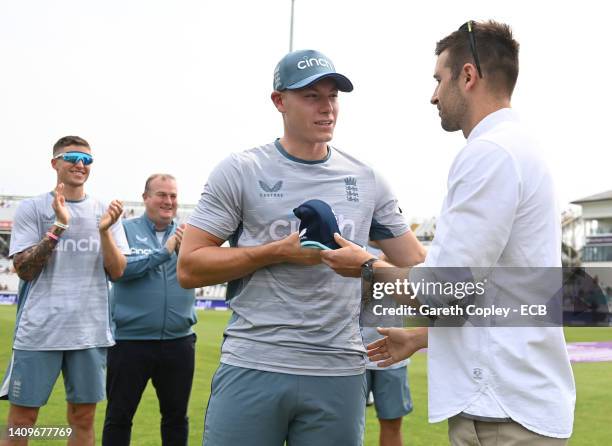 Matthew Potts of England receives his first ODI cap from Mark Wood ahead of the 1st Royal London Series One Day International match between England...