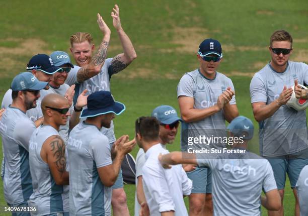 Ben Stokes of England gives Mark wood a clap in the huddle during the 1st Royal London Series One Day International match between England and South...