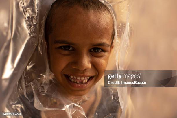 portrait of a boy smiling - tear face stock pictures, royalty-free photos & images