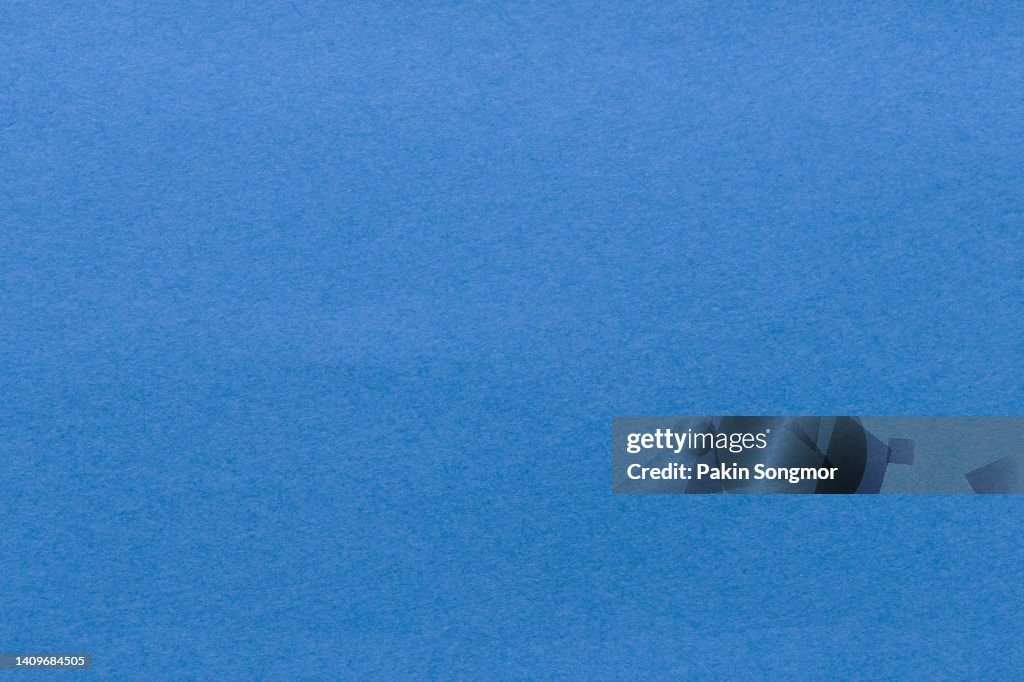 Blue paper sheet texture cardboard background.