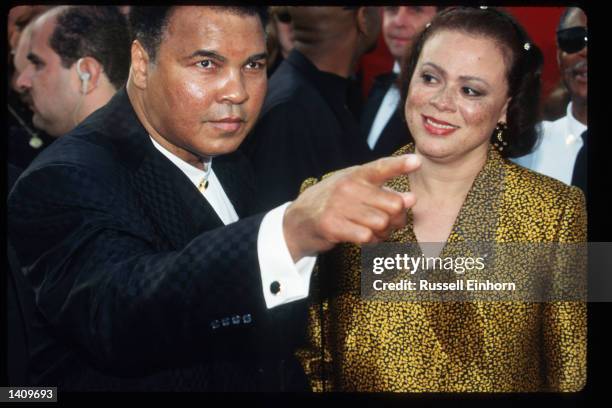 Former boxing champion Muhammad Ali and his wife attend the 69th Annual Academy Awards ceremony March 24, 1997 in Los Angeles, CA.