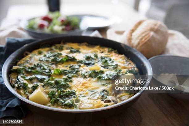close-up of food in bowl on table - frittata stock pictures, royalty-free photos & images