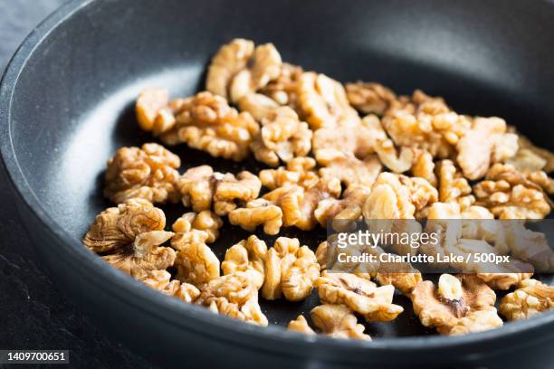 close-up of food in bowl - angebraten stock-fotos und bilder