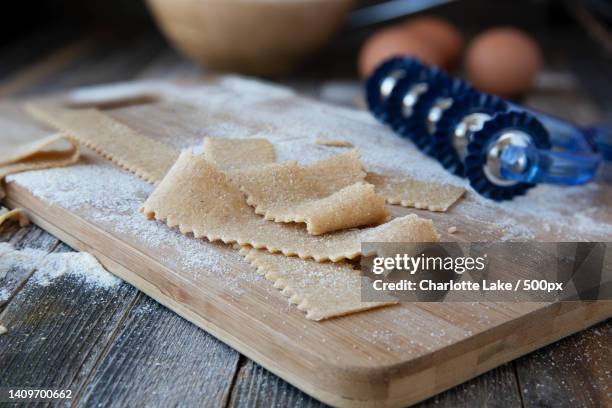 close-up of food on cutting board - pappardelle stock pictures, royalty-free photos & images