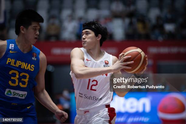 Yuta Watanabe of Japan controls the ball during the FIBA Asia Cup qualification for the quarter-final game between Japan and Philippines at Istora...