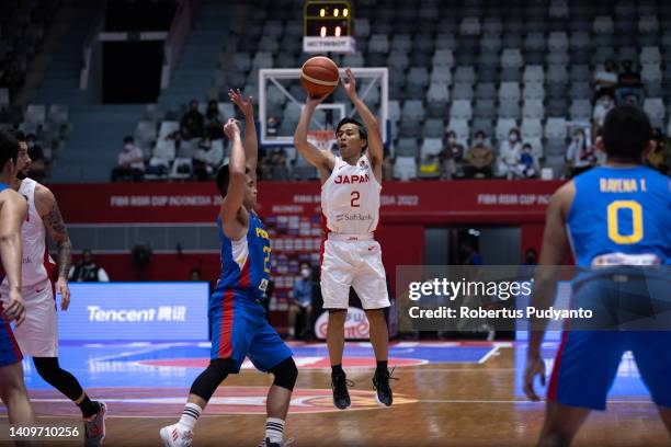 Yuki Togashi of Japan shoots the ball during the FIBA Asia Cup qualification for the quarter-final game between Japan and Philippines at Istora...