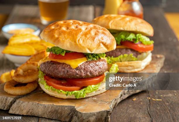 two cheeseburgers on wooden tray - bun bread stock pictures, royalty-free photos & images