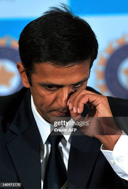 Indian cricketer Rahul Dravid, gestures while addressing a press conference held to announce his retirement from Test cricket in Bangalore on March...