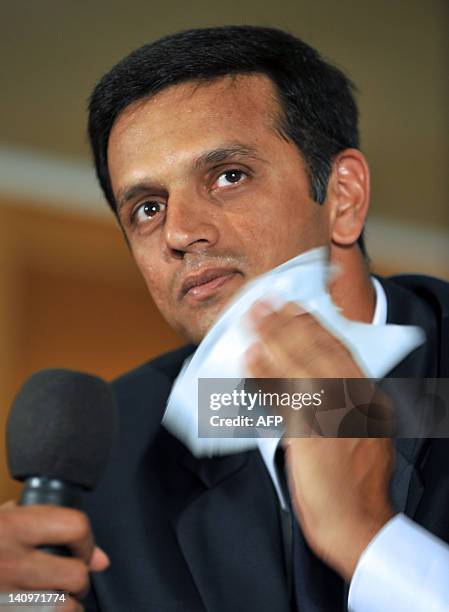 Indian cricketer Rahul Dravid, gestures while addressing a press conference held to announce his retirement from Test cricket in Bangalore on March...