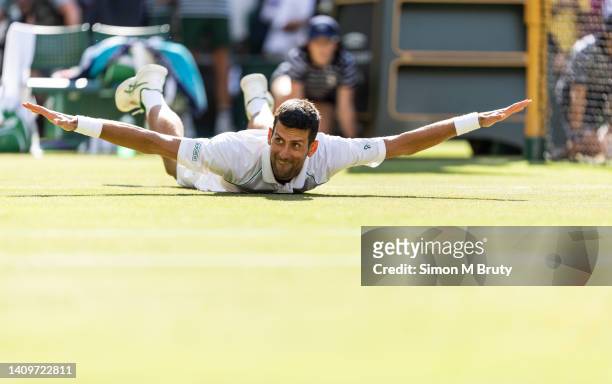 Novak Djokovic of Serbia celebrates after winning the Mens Singles Final against Nick Kyrgios of Australia at The Wimbledon Lawn Tennis Championship...