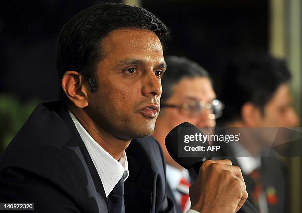 Indian cricketer Rahul Dravid addresses the media while Board of Control for Cricket in India President N. Srinivasan and former cricketer and...