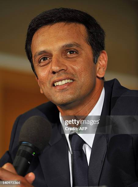 Indian cricketer Rahul Dravid smiles while addressing a press conference held to announce his retirement from Test cricket in Bangalore on March 9,...