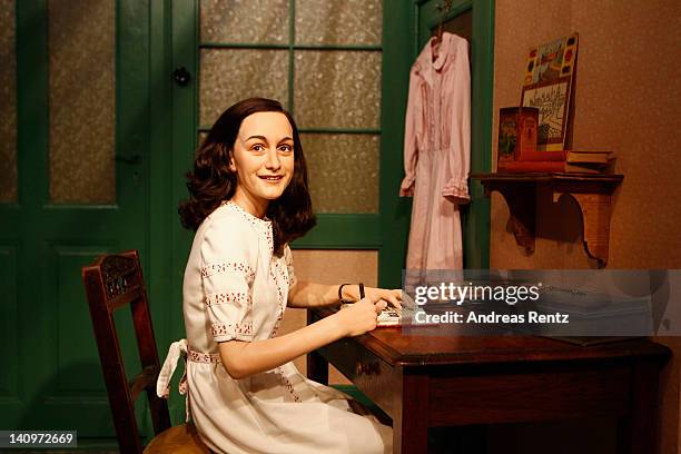 Wax figure of Anne Frank and their hideout reconstruction is unveiled at Madame Tussauds on March 9, 2012 in Berlin, Germany.